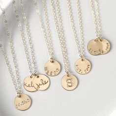 · 1/2" (12.7mm) disc· 14k yellow gold fill, 14k rose gold fill, and sterling silver options· Sturdy, timeless, and built to be worn everydayOur classic 1/2” necklaces are easy to layer, elegant, and ready to be personalized with your most special sentiments, moments, and memories! Created to last a lifetime, these necklaces will remain evergreen even as the years and trends come and go.Personalizing your piece with a message? Reference our fonts and symbols chart for font options and character m Mother's Day Engraved Round Disc Necklaces, Personalized Rose Gold Round Disc Charm Necklaces, Personalized Stamped Round Disc Charm Necklaces, Engraved Rose Gold Round Disc Charm Necklace, Personalized Hand-stamped Rose Gold Charm Necklaces, Disc Necklace, Classic Gold, Birthstone Charms, Gold Filled