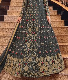 COLOR : Charcoal Gray FABRIC : Top (Gown & Jacket) - Premium Butterfly Net, Bottom & Inner - ATG Silk, Dupatta - Premium Butterfly Net WORK : Heavy Zari Work, Resham Embroidery, Hand Work, Motifs, Pearls, Stones, Swarvoski, Sequins, Lace Border OCCASION : Wedding, Reception, Engagement, Bridal Wear READY-TO-WEAR : NoSTITCHING : Available as semi-stitched fabric, can be stitched using standard size option (+$30). Note: There might be a slight color variation due to lighting and flash used during Anarkali Style Floor-length Churidar With Floral Embroidery, Semi-stitched Long Gown With Intricate Embroidery, Reception Churidar With Floral Embroidery And Long Sleeves, Anarkali Full Length Dress With Intricate Embroidery, Full Length Anarkali Dress With Intricate Embroidery, Traditional Full Length Gown With Resham Embroidery, Intricate Embroidery Full Length Eid Dress, Traditional Full Length Gown With Dabka Work, Semi-stitched Floor-length Gown With Intricate Embroidery