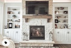 a living room filled with furniture and a flat screen tv mounted above a fire place