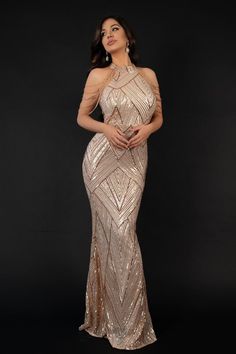 The Sequin Mermaid Dress in Champagne is a stunning and glamorous dress that is sure to turn heads. It features a halterneck neckline, which is adorned with sparkling sequins that catch the light beautifully. The fitted bodice is designed to accentuate your figure, while the mermaid skirt flares out at the knee to create a dramatic and elegant silhouette. The dress is made from a soft, luxurious fabric that drapes elegantly on the body and is a perfect choice for proms, formal events, and other special occasions. The champagne color adds a touch of luxury and glamour to the dress.    Fabric composition: 100% polyester  Washing method: dry cleaning  Colour may vary due to lighting on images.  Item runs true to the size chart and is cut to suit our size chart. Please refer to our size chart Sequin Mermaid Dress, Bella Barnett, Glamorous Dress, Gold Evening Dresses, Dress Jumpsuit, Mermaid Prom Dress, Glamorous Dresses, Sequin Maxi, Sequin Maxi Dress