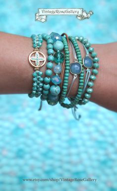 Cross Turquoise Bracelet, Cross Bracelet , Summer Boho Chic Bracelet, Cross Turquoise  Bracelet, Friendship Bracelet  The ultimate SUMMER BOHO CHIC bracelet . A Cross  bracelet for everyday use so unique and so beautiful .... The perfect gift for you and your loved ones  Perfect for Summer time as it is very beautiful on its own or layered with your other favourite pieces  Features turquoise sparkling crystal beads a beautiful gold cross with tiny turquoise colour beads.  This unique bracelet fi Handmade Round Turquoise Bracelets, Turquoise Wrap Bracelet With Round Beads As Gift, Turquoise Wrap Bracelet As Gift, Turquoise Wrap Bracelet Bangle As Gift, Turquoise Bangle Wrap Bracelet Gift, Turquoise Bohemian Bangle Crystal Bracelet, Adjustable Turquoise Stackable Jewelry, Spiritual Hand Wrapped Turquoise Friendship Bracelets, Spiritual Turquoise Hand Wrapped Friendship Bracelets