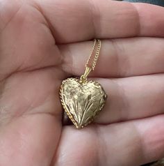 Vintage 12K GF Gold Filled Heart Shaped Engraved Names 1974  Locket Necklace 18" Offered here is a vintage 12k GF gold filled darling heart shaped engraved flower locket necklace measuring; 18" long. The locket is 1.5" x 1.5". It opens on a hinge to reveal 2 compartments for photographs. Engraved :Love Suzzy Sharron Boris 12-26-74 The bail is stamped 12K Gold Filled, but it is too small to photograph.   In nice, sturdy, excellent condition and may have very minimal age related wear Weighs; .14oz Heart Shaped Locket Aesthetic, Affordable Vintage Heart-shaped Jewelry, Vintage Gold Heart Locket, Vintage Open Heart Jewelry For Mother's Day, Collectible Gold Jewelry With Heart Charm, Vintage Charm Necklaces For Anniversary On Valentine's Day, Vintage Yellow Gold Heart Necklace For Valentine's Day, Antique Jewelry For Valentine's Day Anniversary Gift, Vintage Necklaces For Valentine's Day Anniversary