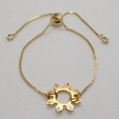 "This lovely Bracelet will show off your Filipino Pride.  Great Gift! Item: Filipino Sun Bracelet Sun Size: .75\" Bracelet Size: Adult Color: Gold Material: Stainless Steel/Gold Plated Hypoallergenic finish" Adjustable Gold Star Chain Bracelet, Adjustable Gold Star-shaped Chain Bracelet, Adjustable Gold Star Bracelet, Adjustable Gold Star Charm Bracelet, Adjustable Metal Crystal Bracelet As Gift, Adjustable Star Shaped Metal Bracelets, Adjustable Metal Star Bracelet, Adjustable Star-shaped Metal Bracelets, Adjustable Star-shaped Metal Bracelet