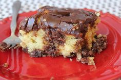 a piece of cake on a red plate with a fork