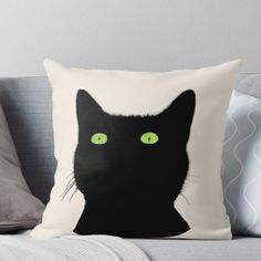 a black cat with green eyes on a white background throw pillow by designbyte