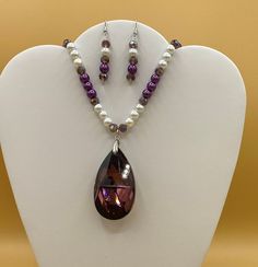 "Large purple teardrop shaped crystal necklace with matching earrings.  This the perfect accent for many styles. Optional matching bracelet available.  Each piece has a custom length to fit all sizes.  Necklace is made from glass pearls and crystals to form a unique and stylish look.  I can convert any of the earrings from pierced to clip on style at no charge, please request this in notes with purchase.  Please do not hesitate to contact me with any questions, I would love to hear from you. Pen Faceted Teardrop Crystal Jewelry, Purple Teardrop Pearl Drop Jewelry, Purple Crystal Jewelry With Faceted Beads, Purple Pearl Drop Round Bead Jewelry, Diy Necklaces, Set Plus Size, Art Deco Pendant, Purple Crystal, Matching Bracelet