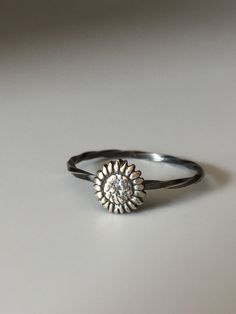 Welcome to Miss November Studio! I specialize in dainty feminine personalized jewelry for the discerning jewelry lover. This listing is for a single sterling silver sunflower stacking ring. All other rings are sold separately. Make a stack! Add a custom stamped band and two gemstone stacking rings with stones like black onyx and garnet. https://www.etsy.com/listing/150142799/set-of-3-rings-one-personalized-message Stacking rings are excellent accessories, not to mention fun to collect and wear. Dainty Silver Stackable Adjustable Rings, Dainty Adjustable Silver Stackable Rings, Elegant Adjustable Sunflower Design Jewelry, Elegant Adjustable Sunflower Jewelry, Sunflower Design Jewelry For Anniversary, Sunflower Design Flower Jewelry For Anniversary, Sterling Silver Flower Jewelry For Everyday, Handmade Stackable Rings For Everyday Wear, Everyday Sterling Silver Flower Jewelry