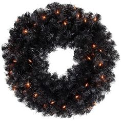 a black wreath with orange lights on it