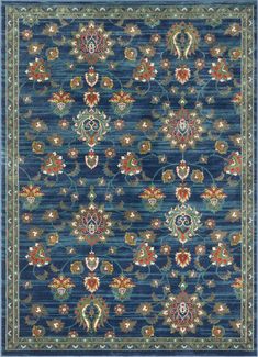 a blue rug with an ornate design on the top and bottom, in different colors