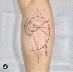 a person with a tattoo on their leg that has lines and dots all over it