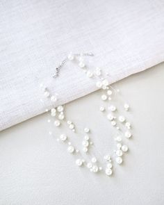 scattered pearl necklace Elegant Pearl White Backdrop Necklace With Pearl Drop, Elegant Pearl Backdrop Necklace With Pearl Drop, Elegant Pearl Backdrop Necklace With Pearl Pendant, White Pearl Backdrop Necklace, Party Pearl Drop Backdrop Necklace, Delicate White Bridal Necklace For Party, Delicate White Backdrop Necklace For Party, Delicate Pearl Backdrop Necklace With Charm, Akoya Pearl Necklace With Pearl Chain For Parties