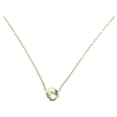 The bezel solitaire necklace combines vintage-inspired detail and modern appeal together for a look that’s timelessly elegant, simple, and classy. Each 14k solid gold bezel setting is hand-wrapped. We've built the necklace for versatility as the length of the chain can be adjusted to 14, 16, or 18 inches to suit individual preference. Sapphires represent the birth month of September. This gemstone is natural and is certified. This is 14k Solid Gold. (We do not sell filled or plated jewelry) Perf Luxury Yellow Gold Solitaire Round Stone Necklace, Yellow Gold Solitaire Gemstone Necklace, Classic Yellow Round Pendant Necklace, Luxury Yellow Round Necklace, Luxury Yellow Round Pendant Necklace, Solitaire Necklace, Solitaire Necklaces, Yellow Sapphire, Birth Month