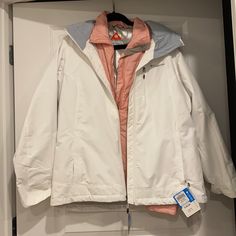 This Ski/Winter Jacket Is 2 In One That Are Detachable And Good Separate Or Together. Brand New Never Used With Tags. From A Pet Free Smoke Free Home. Update: It Was Mishandled During A Move So Tags Are No Longer Present But Remains In Exact Pictured Condition!!! White Windproof Winter Outerwear, White Windproof Outerwear For Fall, White Waterproof Winter Outerwear, White Windproof Outerwear For Cold Weather, White Hooded Windproof Outerwear, White Outdoor Outerwear With Pockets, White Weatherproof Winter Outerwear, Winter Weatherproof White Outerwear, White Windproof Long Sleeve Outerwear