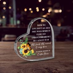 a heart shaped glass with sunflowers on it and a poem written in the center