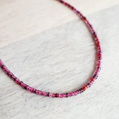 "A long pink and fuchsia mixed glass bead necklace.  The closure is a pewter toggle clasp.  The long hand beaded necklace is available in two lengths (see photo with two options) - 30\" and 36\".  The colors of the beads are a mix of raspberry, cranberry and light pink tones.  The necklace can be wrapped around the wrist several times for a multi-layered bracelet.  You can also purchase charms to be added to the necklace from my shop here (make note at checkout that you wish for charms to be attached): https://www.etsy.com/listing/1147255532/personalized-sterling-silver-charm?click_key=41a8f205aa77c475953fc701d4090ca3beec6950%3A1147255532&click_sum=06541664&ref=shop_home_active_2&crt=1&sts=1 Your long glass beaded necklace will arrive in an E. Ria Designs jewelry gift box, ready for giving Pink Beaded Necklaces With Spacer Beads For Gifts, Pink Beaded Chain Beads As Gift, Pink Beaded Chain Jewelry For Gift, Pink Single Strand Beaded Necklaces For Jewelry Making, Pink Tiny Beads Necklace For Jewelry Making, Pink Beaded Necklace With Tiny Beads For Gift, Pink Beaded Necklace With Round Beads For Gifts, Pink Round Beaded Necklace For Gift, Pink Round Beaded Jewelry For Festivals