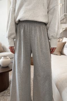 The Chelsea Relaxed Lounge Pants in Heather Grey are great for everything from lounging around the house to going out and about this fall! Featuring pockets, heather grey color, lightweight knit fabric, elastic waistband, raw hem detail and a true to size fit. Style these knit pants with a cozy sweater and boots! Details Pockets Heather grey color Lightweight knit fabric Elastic waistband True to size fit Gabriella is wearing a size S Fabric 85% Polyester 12% Cotton Sizing: S Inseam: 29" M Insea Cheap Gray Sweater For Loungewear, Cheap Relaxed Fit Wide Leg Pants For Loungewear, Lounge Wear Pant, Knit Sweater With Pants, Cozy Lounge Pants, Luxury Gray Bottoms For Loungewear, Cheap Gray Loungewear Bottoms, Cheap Gray Lounging Bottoms, Affordable Gray Loungewear Sets