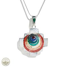 Elevate your style with our meticulously handcrafted 950 Silver Chakana Pendant, artfully embedded with an array of natural multicolored stones. This Chakana, a symbol rich in Andean heritage, becomes a wearable masterpiece, each piece a testament to skilled craftsmanship and timeless elegance. Product Features: Material: Forged from premium 950 silver, this Chakana pendant blends traditional significance with contemporary design, enhanced by the vibrant hues of natural stones. Handcrafted Excel Multicolor Round Gemstone Jewelry, Multicolor Fusion Necklace For Gift, Multicolor Fusion Necklaces For Gifts, Traditional Multi-stone Necklace For Gift, Fusion Multi-stone Round Necklace, Traditional Multicolor Gemstone Jewelry, Bohemian Multicolor Gemstone Jewelry, Multicolor Round Amulet Pendant Jewelry, Multicolor Handmade Amulet Jewelry