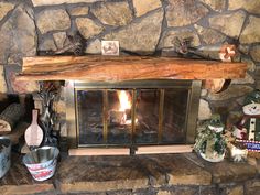 a fireplace with logs and other items around it