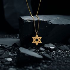 Embrace your faith and heritage with our gold Star of David pendant, meticulously crafted in the USA. Symbolizing Jewish identity and protection, each piece is a profound expression of belief and tradition. PENDANT INFORMATIONThis pendant is made of real, solid gold.• Made in USA• Material: 14k or 18k solid gold• Finish: polished• Height: 1.1" (28 mm) | *includes the small circle, bail dimensions not included• Width: 0.9" (22,5 mm)• Pendant weight: approx. 5 grams (14k)• Bail: fits up to 4 mm ch Symbolic Star Of David Engraved Necklace, Gold Sterling Silver Star Of David Necklace, Star Of David Yellow Gold Plated Jewelry, Gold Engraved Star Of David Necklace, Star Of David Tarnish Resistant Necklace Gift, Spiritual Yellow Gold Necklace With Star Charm, Engraved Star-shaped Yellow Gold Necklace, Symbolic Star Of David Engraved Jewelry, 14k Gold Star Of David Necklace, Tarnish Resistant