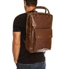 Custom engraved with your logo, our Swanky Badger Vegan Leather Backpack is the perfect, premium backpack for your staff or clients.The outer shell is made with our Brown Premium Vegan leather, and inside you will find plenty of storage. There's a designated padded pocket large enough for a 17" laptop, as well as a zippered interior pocket to hold smaller items, and large exterior flap pocket to house chargers and cords. Bag features include; - Laser Engraved with your Logo - Adjustable Shoulder Large Capacity Leather Bag For Students, Leather Backpack With Large Capacity For On-the-go, Classic Rectangular Backpack For School, Classic Rectangular School Backpack, Leather Backed Backpack For Everyday Use, Large Capacity Classic Leather Backpack, Classic Large Capacity Leather Backpack, Brown Student Backpack, Classic Laptop Bag Backpack For Everyday Use