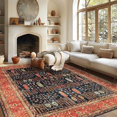 a living room filled with furniture and a large rug on top of a wooden floor