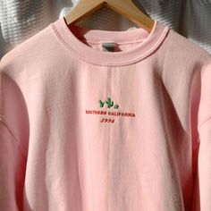 "*SIZES ARE UNISEX* -For women, I'd suggest your usual size for a regular fit (size up for a more relaxed fit). Men should size up for a more relaxed fit. *these sweatshirts are extra comfy when oversized 🌵NEW! \"Southern California 1996\" and a cute cacti design embroidered on a comfy vintage-style pink crewneck. Perfect for any occasion or gift for him or her. A sturdy and warm sweatshirt bound to keep you warm in the colder months. A pre-shrunk, classic fit sweater that's made with air-jet s Cactus Sweatshirt, Relaxed Fit Men, California Sweatshirt, Crewneck Vintage, Streetwear Pants, Summer Sundress, Christian Sweatshirt, Embroidered Crewneck, Plant Lover Gift