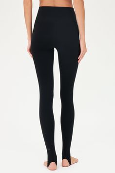 Our famous, form fitting high waist legging redesigned as a stirrup tight. Our ultra luxe Airweight fabric has a supremely soft hand and second skin comfort. BEST FOR: hot yoga, barre, Pilates. Model is 5'10" and wears a size small. Full Length Leggings With Contoured Waistband, Compressive Smoothing Leggings For Pilates, Smoothing Compressive Leggings For Pilates, Sleek Tight Sports Bottoms, Sleek Fitted Training Bottoms, Micro-elastic Black Yoga Bottoms, High Stretch Sleek Sports Tights, Sleek Compressive Leggings For Pilates, Stretch Black Leggings With Contoured Waistband