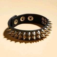 Unisex Faux Leather Bracelet With Silver-Tone Spiked Studs Snap Fasteners In 3 Different Sizes Length: 7.9 In (20 Cm) Tags Goth Gothic Emo Punk Moto Grunge Edgy Hot Topic Punk Black Bracelet With Silver Studs, Black Leather Punk Bracelet With Silver Studs, Silver Spiked Bracelets For Parties, Black Metal Stud Jewelry, Black Spiked Jewelry For Concerts, Black Spiked Jewelry For Festival, Black Metal Spiked Jewelry, Black Metal Jewelry With Spikes, Adjustable Silver Bracelet With Spikes