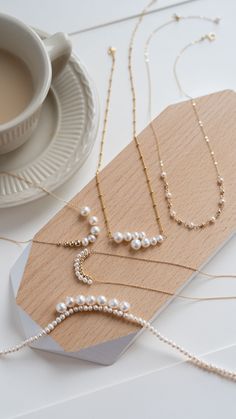 This stunning piece features intricately wrapped silk strands, meticulously crafted by hand to create a unique and elegant design. Each necklace is a work of art, showcasing the skill and attention to detail of the artisan. Versatile and timeless, this necklace adds a touch of sophistication to any outfit, whether worn casually or for a special occasion. Metal: 14K Gold Filled Gemstone: Freshwater Pearl Length Diameter: 450mm(includes adjustable chain) Pearl Length: 4mm Elegant Multi-strand Pearl Necklace, Elegant Gold Beaded Necklaces, Elegant Multi-strand Yellow Gold Jewelry, Elegant Multi-strand Wedding Necklace, Elegant Yellow Gold Multi-strand Jewelry, Elegant Multi-strand Necklace With Pearl Pendant, Delicate Beaded Necklaces For Formal Occasions, Delicate Beaded Necklace For Formal Occasions, Elegant Yellow Gold Beaded Necklaces With Pearl Chain