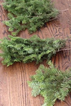 some green plants are laying on a wooden table and ready to be cut into pieces