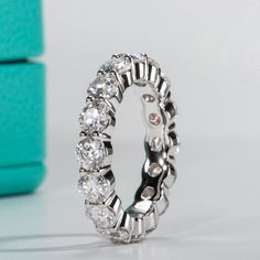 This eternity band ring is incredibly versatile and perfect for everyday wear, adding a touch of glamour to your outfit. It is also great for special occasions and can be stacked with other rings or paired with other pieces of jewelry to create a truly personalized look. Description Sterling Silver Moissanite Stones Round Stone Shape Clear Color 0.3ct (Each Stone) Weight About 3.5g GRA Certified Vs Clarity Stackable Rings Fine Jewelry, Classic Stackable Diamond White Jewelry, Elegant Stackable Round Cut Diamond Ring, Elegant Stackable Round Diamond Ring, Timeless Round Stackable Rings, White Classic Eternity Band, Classic Vvs Clarity Eternity Band, Luxury Eternity Band Promise Ring, Elegant Stackable Moissanite Wedding Rings