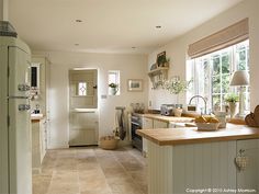 a kitchen filled with lots of counter top space next to a refrigerator freezer oven