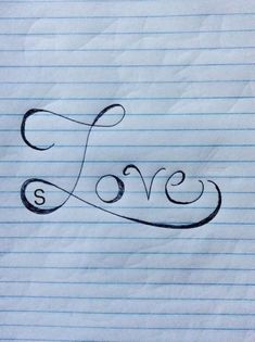 the word love is written in cursive writing on lined paper