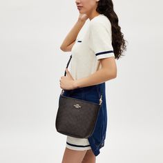 This City Bucket Bag is crafted of Signature Coated Canvas. It's a versatile canvas bucket bag that features an inside zip pocket for your essentials and a snap closure to keep everything secure. The detachable handle and strap allow for shoulder or crossbody wear making it perfect for any look. Whether you're running errands or relaxing on the weekend this small canvas bucket bag is a versatile pick. Canvas Bucket Bag, Sling Bag Mini, Coach Outlet, This City, Signature Canvas, Small Canvas, Belt Bag, The Weekend, Running Errands