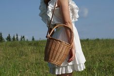 FREE SHIPPING TO USA & EUROPE - ORDERS OVER $35 Handmade Basket made with wicker. DELIVERY TIME: Europe: 3 to 5 days USA: 3 to 5 days Other countries: 3 to 7 days Long leather handle adjustable made with genuine leather. Crossbody bag This is an absolute summer must-have! Description This cute, basket bag is the perfect accessory, great for going to the beach, a casual day out around town, a quick walk in the park, for the farmers market, or just a cozy afternoon in the cafe. We really love Basket Bag Aesthetic, Large Capacity Bucket Bag For Picnic, Natural Bucket Bag For Picnic, Natural Bucket Shoulder Bag For Picnic, Natural Color Bucket Shoulder Bag For Picnic, Jane Birkin Basket, Purse Aesthetic, Wicker Purse, Popular Bags