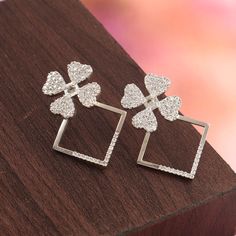 CZ silver floral earring. Gift for her. 925 solid sterling silver earring. CZ diamond flower earring Metal - 925 Sterling Silver Product Type - Silver earrings Main stone - Cubic Zirconia Stone Dimension - 1.50 MM, 1.80 MM Stone Shape - Round Total Weight -  6.50 Grams Approx. (2 piece) We can also make this jewelery in Gold, White Gold and Rose Gold as per customer's request. **CUSTOMER SERVICE** Our First Priority is Customer Satisfaction and Happiness. I gladly accept CUSTOM ORDER If any, DM Me freely. If Any Query About The Product , Contact Me Anytime, Always Here For Your Solutions. Shipping Policy :-  *Shipping Thru FedEx, DHL Express, USPS & Other Courier Services.  * We ship item(s) from India to Worldwide Within 3-5 business days after the payment has been cleared.  * We use USPS Sterling Silver Single Flower Earring For Weddings, Flower Shaped Earrings With Sparkling Stones For Gift, Flower-shaped Earrings With Sparkling Stones, Silver Flower Drop Earrings For Wedding, Sterling Silver Flower Earrings Fine Jewelry, Sterling Silver Flower-shaped Earrings, Diamond Flower Drop Earrings For Anniversary, Silver Flower Charm Earrings, Silver Flower-shaped Bridal Earrings For Anniversary