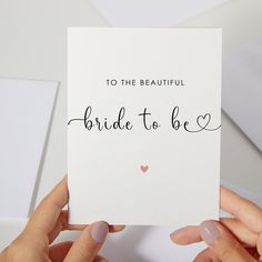 two hands holding up a card that says to the beautiful bride to be