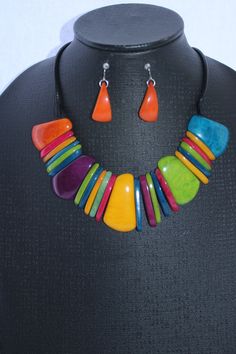 Tagua Set of Earrings and Necklace multicolor. Handmade. Natural jewelry. Organic. For women Handmade set of neacklace and eaarings. Handcrafted from tagua nut from Colombian rainforest. Pure and organic.  Perfect set for women's special occasion. Gift for her, casual, formal, and dress up. Matching earrings are included. The entire length of the necklace is  11.5 inches long (29 cm).  Each bead is approximately 1.5 inches - 4 cm. Perfect gift for daughters, girlfriends, Grandmothers, Mothers, W Colorful Costume Jewelry For Gifts, Colorful Costume Jewelry Necklaces For Gifts, Colorful Costume Jewelry Gift, Unique Multicolor Adjustable Jewelry, Multicolor Dangle Necklaces In Costume Jewelry Style, Unique Adjustable Multicolor Jewelry, Multicolor Dangle Jewelry For Gifts, Colorful Adjustable Unique Jewelry, Multicolor Costume Jewelry Earrings For Gift