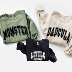 Matching Family Sweatshirt for Halloween, Momster, Dadcula and Little Monster Sweatshirt, Spooky Family Shirt, Halloween Family Sweatshirts 🌸 Soft & Lightweight Material - Graphic tees for women are made from a soft, lightweight, and stretchy fabric that provides a familiar and comfortable feel. You'll love wearing it all day long. 🌸 GREAT GIFT:  Good choice as a gift for your mom, sister, your wife or anyone you want to send a gift.  🌸 Wash: Recommended machine/hand wash and wash inside out and line dry. PLEASE DON'T Put IT IN THE DRYER, DRY CLEAN, or BLEACH. ♥️Designed and Handmade in the USA♥️ Family Matching Tshirts, Monster Shirt, Halloween Long Sleeve Relaxed Fit T-shirt, Halloween Cotton Sweatshirt With Character Print, Halloween Cotton Pre-shrunk Sweatshirt, Halloween Band Merch Long Sleeve Sweatshirt, Halloween Long Sleeve Band Merch T-shirt, Fall Black T-shirt With Lettering, Black T-shirt With Lettering For Fall