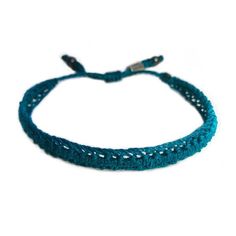 SUMMER WOVEN BRACELET: This hand-knotted, unisex, woven bracelet includes two genuine Hematite stones and a Rumi Sumaq logo bead. In a beautiful color shade of deep turquoise blue, the bracelet makes a wonderful beach accessory for summer. Purchase two as adult friendship bracelets or as a unique "his and her" couples bracelet set. Custom made in all wrist sizes, this bracelet could also be a great parent-child bracelet set.SUPERIOR CRAFTSMANSHIP:Please don't confuse this woven bracelet with you Casual Braided Bracelet Jewelry, Casual Braided Bracelet, Adjustable Hand Knotted Bracelets For Gifts, Adjustable Hand Knotted Bracelets As Gift, Handmade Turquoise Braided Bracelets In Spiritual Style, Handmade Turquoise Spiritual Braided Bracelets, Adjustable Turquoise Friendship Bracelets With Sliding Knot, Casual Braided Bracelets For The Beach, Casual Braided Bracelets For Beach