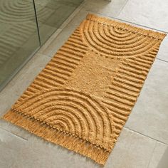 a bathroom area with a rug on the floor