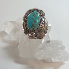 This vintage, handmade, Native American Silver ring is the perfect addition to your collection! Size 7.5, features a beautiful Turquoise cabochon with a decorative etched leaf curling around it. Elegant Sterling Silver Turquoise Cabochon Ring, Collectible Turquoise Cabochon Ring, Bohemian Blue Turquoise Cabochon Ring, Vintage Blue Cabochon Turquoise Ring, Southwestern Turquoise Cabochon Rings, Solitaire Ring, Turquoise Ring, Native American, Nativity