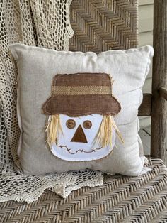 a pillow with a scarecrow face on it