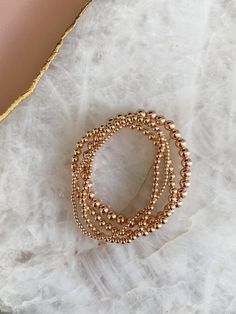 14k rose gold filled beaded stretch bracelet. Please measure your wrist and select your size in the dropdown as this bracelet is not one size fits all. SIZING TIP: To find out your bracelet size, wrap a piece of string around your wrist to measure (place it just above the wrist bone.) Then measure the length of the string. Then I'd recommend adding 0.8 inches (2cm) to that measurement to get your correct bracelet size. Rose Gold Stackable Stretch Bracelet With Round Beads, Rose Gold Stackable Bracelet With Round Beads, Dainty Rose Gold Beaded Bracelets, Stackable Round Beads Bracelets In Rose Gold, Rose Gold Beaded Bracelets With 8mm Beads, Hand-strung Rose Gold Beaded Bracelets As Gift, Hand-strung Rose Gold Beaded Bracelet As Gift, Adjustable Rose Gold Beaded Bracelets With 8mm Beads, Stackable Rose Gold Bracelets In 14k Gold Filled