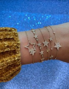 "𝓦𝓮𝓵𝓬𝓸𝓶𝓮 𝓽𝓸 𝓛𝓲𝓸𝓷𝓱𝓮𝓪𝓻𝓽 𝓳𝓮𝔀𝓮𝓵𝓻𝔂 𝓢𝓱𝓸𝓹 ♥ Beautiful and delicate Diamond Star Charm Bracelets available in 4 variations. Please allow 1-5 weeks for delivery. *Please check measurements below, items may appear larger on the screen. ♥ 5 mini Star Bracelet with pave diamonds with 6 bezel set diamonds Measurements: 5.5mm Length: 7\" adjustable to 6.5\" Diamonds: 0.29 Carats ♥ 1 Star Full Pave Diamond Single Star Bracelet with 6 bezel set diamonds Measurements: 14.5mm Length: Luxury Dainty Star Jewelry, Luxury Minimalist Jewelry With Star Charm, Cheap Sparkly Gold Jewelry, Luxury Elegant Star-shaped Bracelet, Cheap Casual Star-shaped Bracelets, Affordable Gold Jewelry With Star Charm, Diamond Star Gold Jewelry, Luxury Diamond Jewelry With Star Charm, Affordable Trendy Jewelry With Star Charm