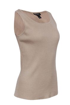 This stylish ribbed tank top from St. John is anything but basic. Crafted from soft and luxurious wool in versatile dark beige, this knit tank is a cozy-chic wardrobe essential. Whether paired with a blazer and slacks for the office or dressed down for a casual weekend look, it's a must-have for any fashion-forward individual. Size M 100% Wool Rounded neckline Stretchy ribbed knit Bust﻿ 30" Waist 29.5" Shoulder to hem 24.5" Elegant Solid Ribbed Tank Top, Fitted Beige Ribbed Sweater Vest, Classic Fitted Beige Tank Top, Elegant Ribbed Tank Top For Fall, Elegant Ribbed Tank Top For Layering, Beige Ribbed Tank Top For Fall, Everyday Beige Knit Tank Top, Ribbed Beige Tank Top For Fall, Fall Beige Ribbed Tank Top