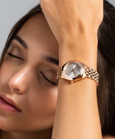 A classic design, elevated. The bold and urban Vivid watch features a statement round face with chunky outer casing that’s juxtaposed by the delicate sunray dial, minimalist numeral. In silver and white with a feminine rose gold twist and a 32mm face, Vivid is a powerful piece pairing androgynous design with robust links made of gold-plated stainless steel for effortless sophistication. Trendy Wrist Watches For Women, Everyday Watches Women Casual, Styling Watches Women, Rose Gold Watches Women Classy, Timeless Jewelry Pieces, Trending Watches For Women, Feminine Watches, Classic Watches Women, Women Watches Classy Elegant