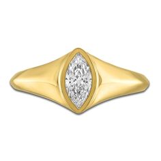 a yellow gold ring with a pear shaped diamond