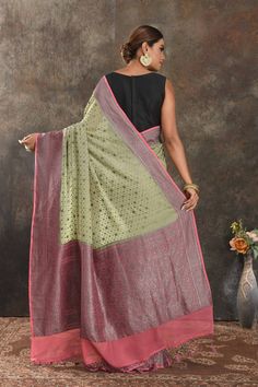 Be vision of elegance on special occasions in this pastel green georgette sari. The saree is enhanced with antique zari buta and antique zari pink border. It comes with a matching blouse piece. Disclaimer: The shown stitched blouse on the model is for display purpose only. The saree comes with a matching blouse piece and finished with fall and piko. Green Semi-stitched Pre-draped Saree With Meenakari, Designer Green Pre-draped Saree With Meenakari, Festive Green Pre-draped Saree With Meenakari, Bollywood Style Green Meenakari Pre-draped Saree, Bollywood Green Meenakari Pre-draped Saree, Pista Green Meenakari Saree, Pista Green Pre-draped Saree With Zari Weaving, Festive Light Green Traditional Wear With Zari Work, Pista Green Anarkali Blouse Piece With Zari Weaving