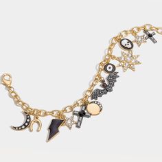 Unveil a touch of eerie enchantment with our Halloween Charm Bracelet. This macabre masterpiece, clad in 18K gold on brass, conjures visions of a spine-chilling soirée. Adorned with a dripping oil charm, it's as if the very essence of a haunted house has been captured. Sparkling cubic zirconia stones add a ghostly glow, casting a bewitching spell under the moonlight. A perfect accessory for those who revel in the gothic and grotesque. Dare to be different and let your Halloween spirit shine. DET Symbolic Gold Bracelets With Charms, Gothic Gold Party Jewelry, Gold Gothic Jewelry For Parties, Gold Gothic Party Jewelry, Gold Symbolic Metal Charm Bracelet, Gothic Gold Jewelry For Halloween, Symbolic Metal Jewelry For Halloween, Gold Halloween Party Jewelry, Witchy Gold Jewelry For Halloween